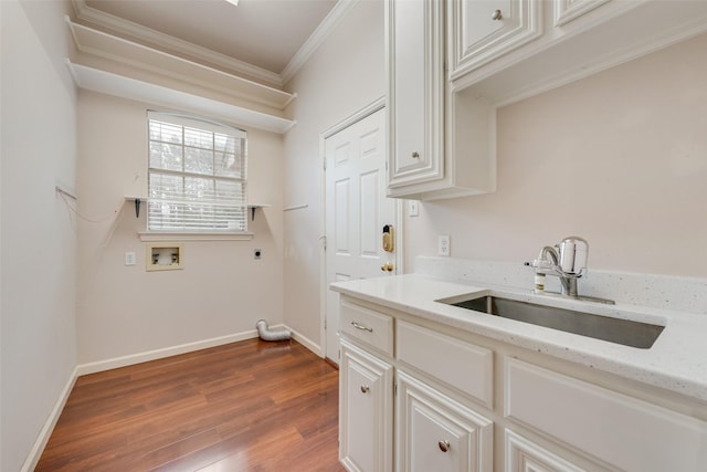 washroom featuring wood-type flooring, sink, ornamental molding, washer hookup, and electric dryer hookup