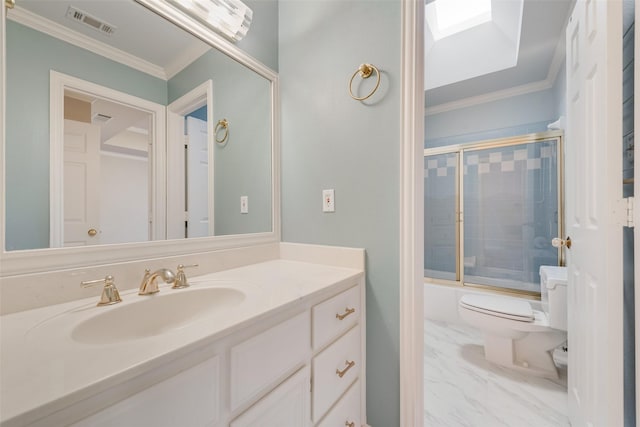 full bathroom with crown molding, combined bath / shower with glass door, a skylight, vanity, and toilet