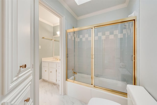 full bathroom featuring crown molding, shower / bath combination with glass door, a skylight, vanity, and toilet