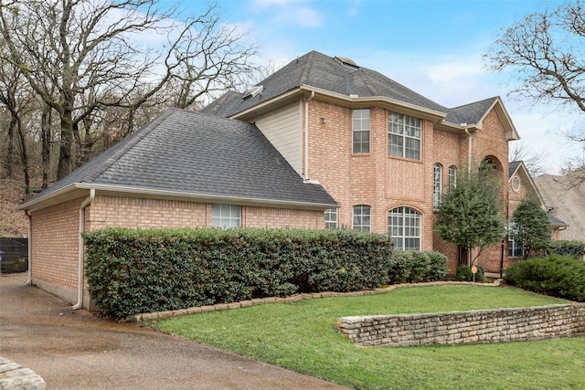 view of home's exterior featuring a yard