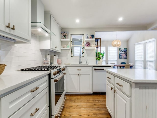 7010 San Mateo Blvd, Dallas, TX 75223 - kitchen featuring white appliances, a sink, open shelves, backsplash, and wall chimney range hood