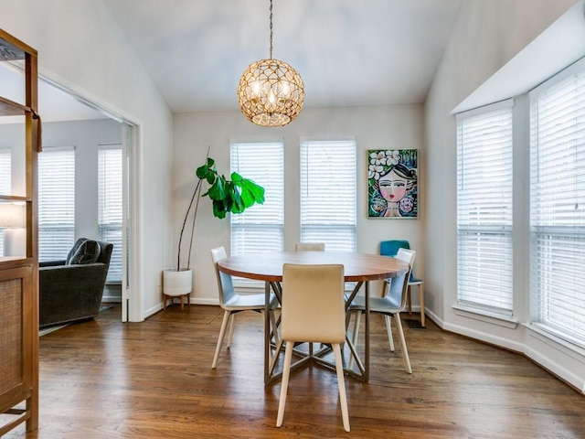 7010 San Mateo Blvd, Dallas, TX 75223 - dining space with vaulted ceiling, a chandelier, wood finished floors, and baseboards