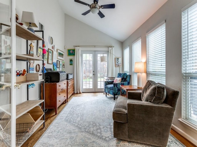 7010 San Mateo Blvd, Dallas, TX 75223 - sitting room with french doors, wood finished floors, ceiling fan, healthy amount of natural light, and high vaulted ceiling