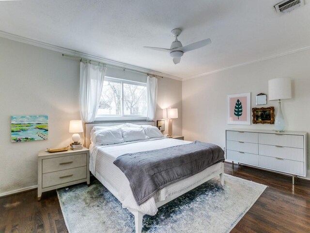 7010 San Mateo Blvd, Dallas, TX 75223 - bedroom featuring crown molding, wood finished floors, ceiling fan, and baseboards