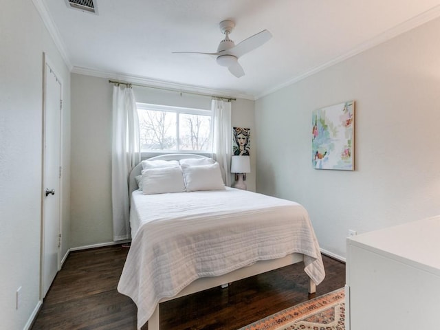 7010 San Mateo Blvd, Dallas, TX 75223 - bedroom with dark wood-style flooring, ornamental molding, baseboards, and ceiling fan