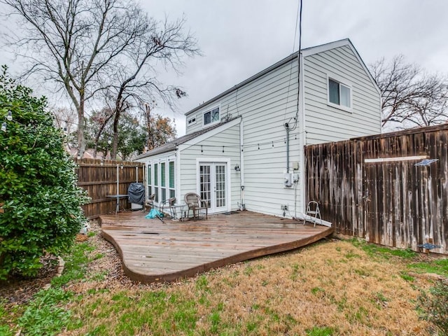 7010 San Mateo Blvd, Dallas, TX 75223 - back of house featuring french doors, a wooden deck, and a fenced backyard