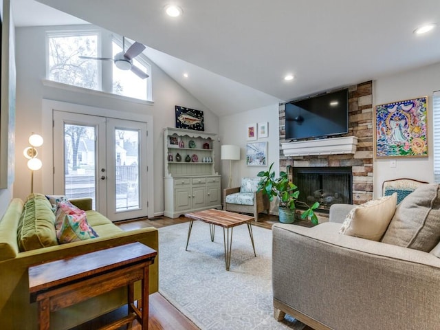 7010 San Mateo Blvd, Dallas, TX 75223 - living room featuring vaulted ceiling, a fireplace, wood finished floors, a ceiling fan, and recessed lighting