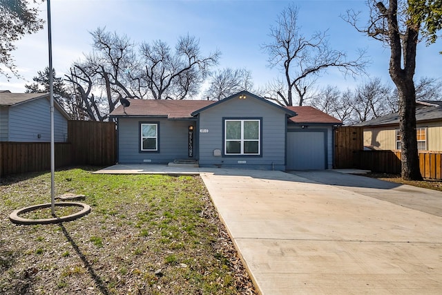 single story home featuring a garage and a front yard