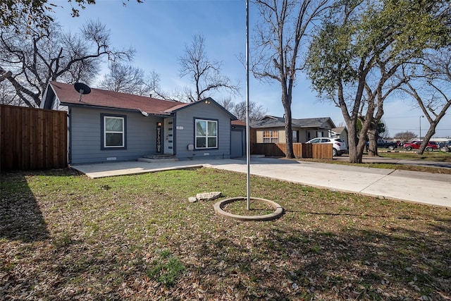 ranch-style home with a patio area and a front lawn