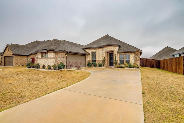 french country inspired facade with a garage and a front lawn