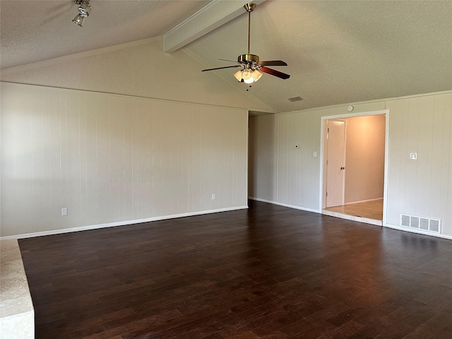 unfurnished room with vaulted ceiling with beams, wood finished floors, visible vents, baseboards, and a ceiling fan