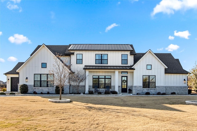 modern farmhouse with a front lawn