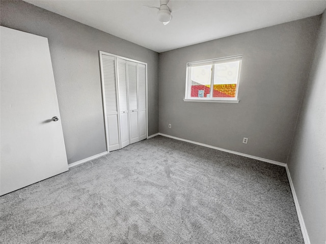 unfurnished bedroom with carpet flooring and a closet