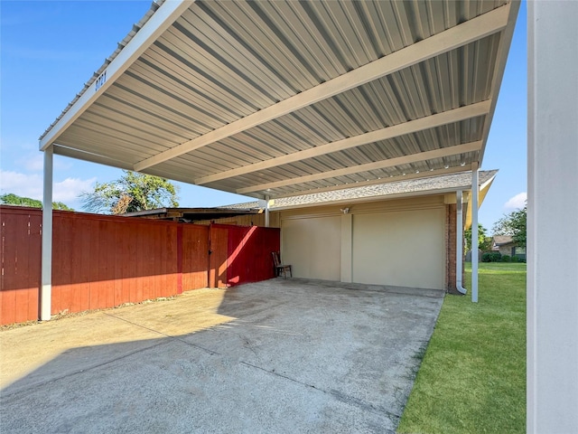 view of patio / terrace featuring a carport and a garage