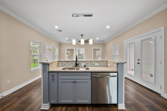 kitchen featuring pendant lighting, sink, dishwasher, gray cabinetry, and a kitchen island with sink