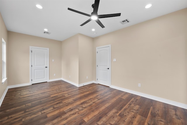 unfurnished room featuring dark hardwood / wood-style floors and ceiling fan