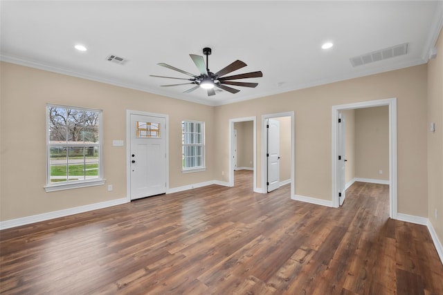 entryway with dark hardwood / wood-style flooring, crown molding, and ceiling fan