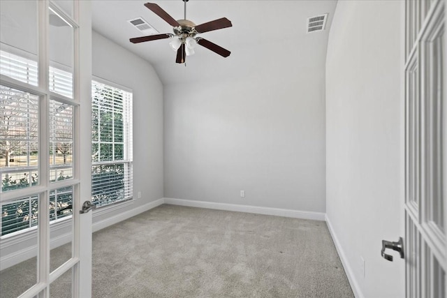 carpeted empty room featuring lofted ceiling and ceiling fan