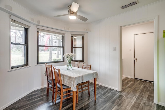 dining area featuring ornamental molding, dark hardwood / wood-style floors, and ceiling fan