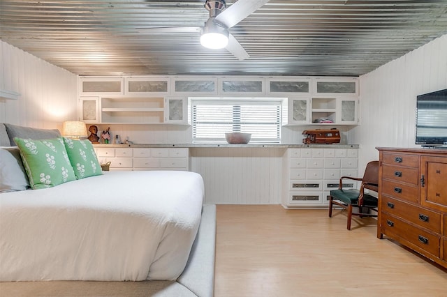 bedroom featuring ceiling fan, light wood-type flooring, and wooden ceiling