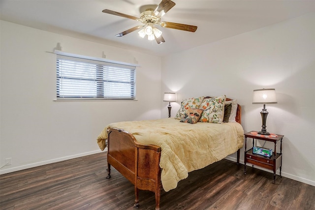 bedroom with dark hardwood / wood-style flooring and ceiling fan