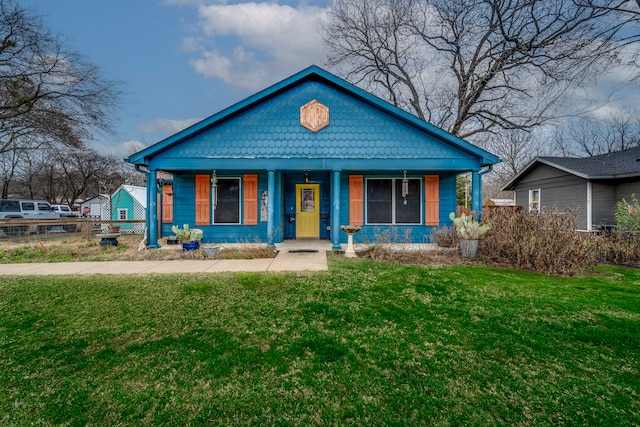 bungalow-style home with a porch and a front yard