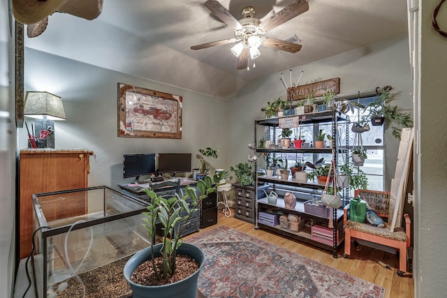 office with hardwood / wood-style flooring, vaulted ceiling, and ceiling fan