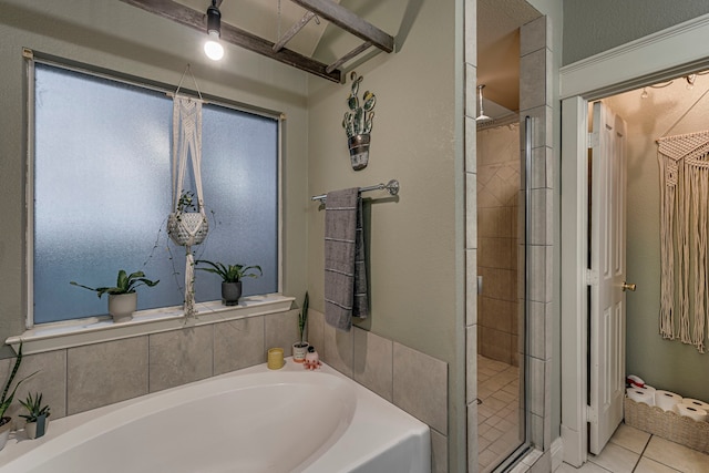 bathroom featuring tile patterned flooring and plus walk in shower