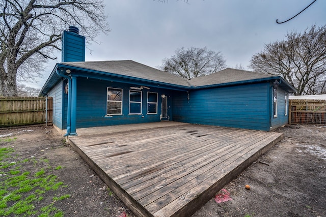 rear view of house featuring a deck