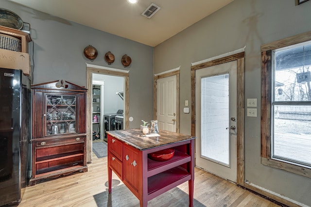 doorway to outside featuring light hardwood / wood-style flooring