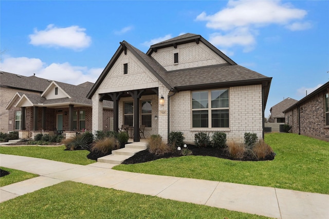 view of front of home with a front lawn and covered porch