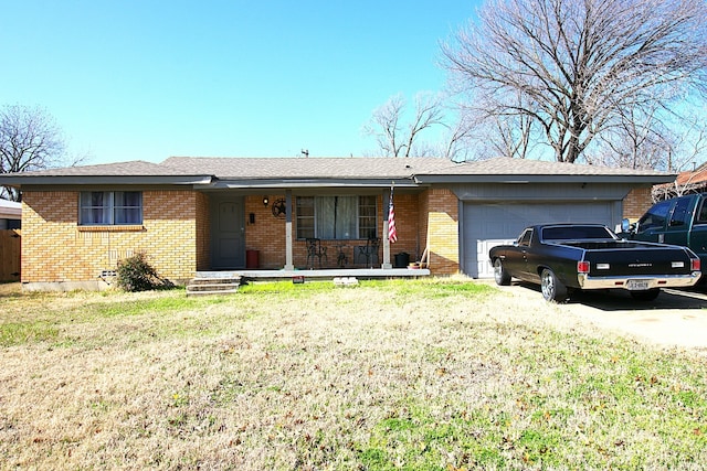 ranch-style home featuring a garage, a porch, and a front yard