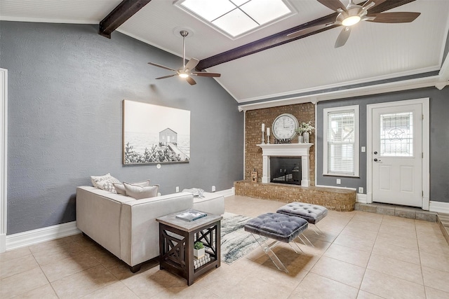 tiled living room with lofted ceiling with beams, ceiling fan, and a fireplace