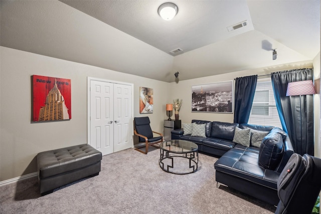 living room featuring vaulted ceiling and carpet flooring