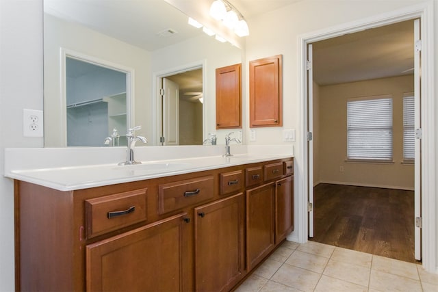 bathroom with vanity and tile patterned flooring