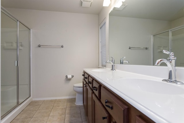 bathroom with vanity, toilet, an enclosed shower, and tile patterned flooring