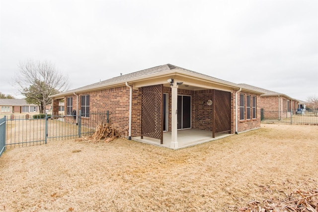 rear view of property featuring a patio