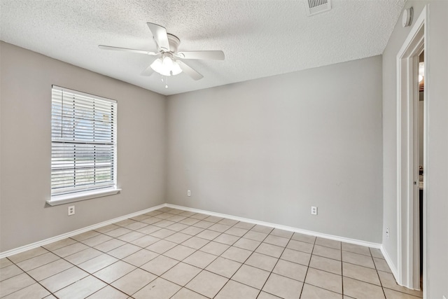 unfurnished room featuring a textured ceiling and ceiling fan