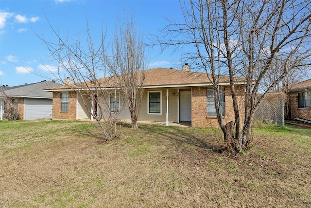 ranch-style home with a front lawn