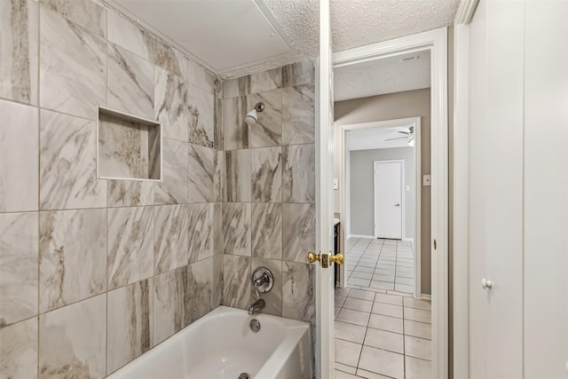 bathroom with tile patterned flooring, a textured ceiling, and shower / bathtub combination