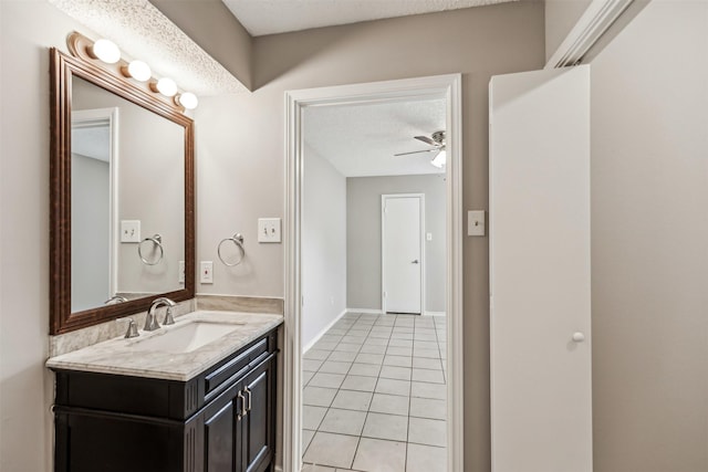 bathroom featuring vanity, ceiling fan, tile patterned floors, and a textured ceiling