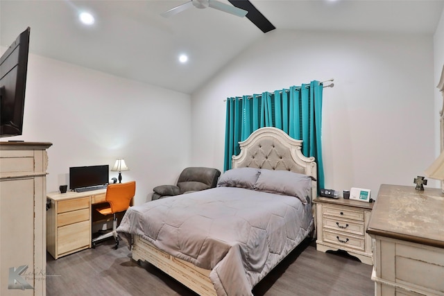 bedroom with dark hardwood / wood-style flooring, lofted ceiling, and ceiling fan