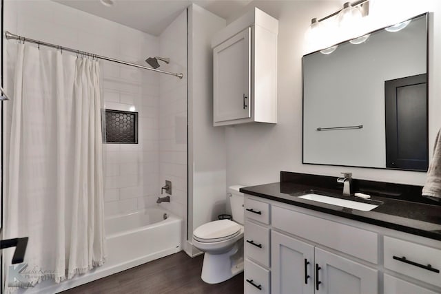 full bathroom with vanity, hardwood / wood-style floors, shower / bath combination with curtain, and toilet