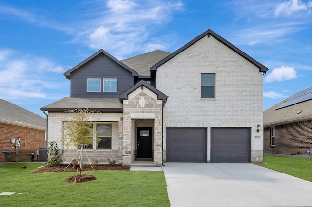 view of front of home with a garage, central AC, and a front lawn