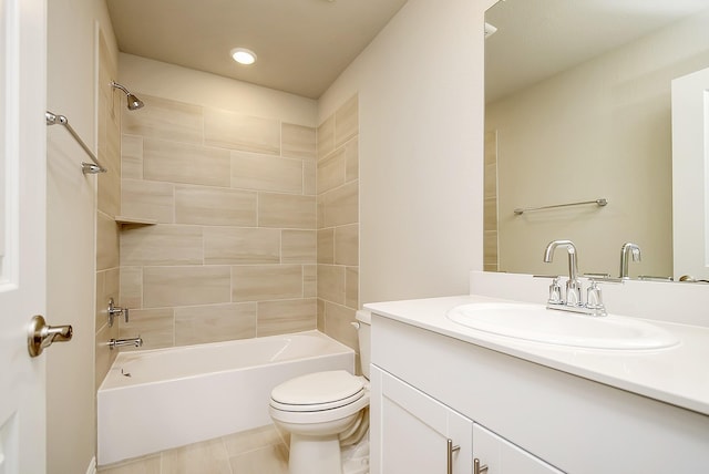 full bathroom with tile patterned floors, vanity, toilet, and tiled shower / bath combo