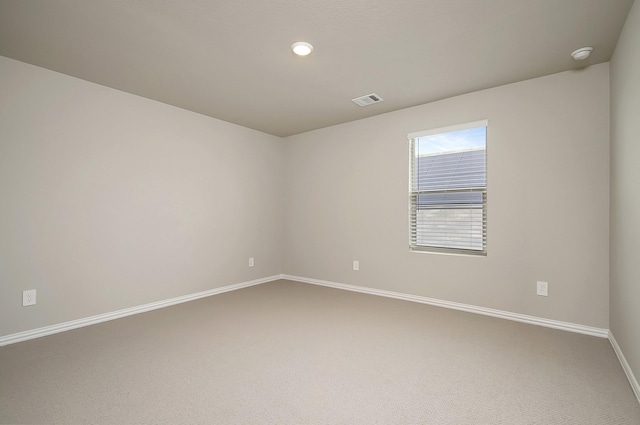 view of carpeted spare room