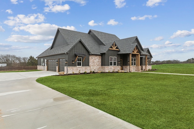 modern farmhouse style home featuring a shingled roof, concrete driveway, a front lawn, board and batten siding, and brick siding