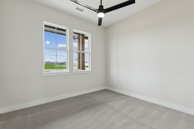 carpeted empty room with ceiling fan