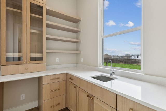 kitchen with sink and light brown cabinets