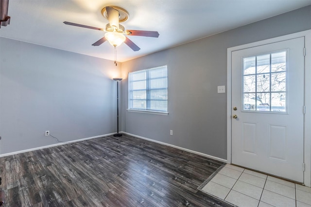 entryway featuring ceiling fan, hardwood / wood-style flooring, and a healthy amount of sunlight